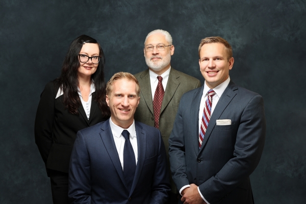 From left to right: Attorney Julia Chidley, Attorney Christopher J. Koppes, Attorney Allen W. Larson, and Attorney Zachary J. Hetfield. From left to right: Attorney Julia Chidley, Attorney Christopher J. Koppes, Attorney Allen W. Larson, and Attorney Zachary J. Hetfield.